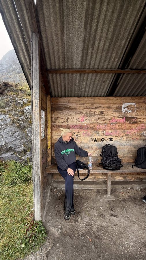 Resting in a mountain shelter with backpacks