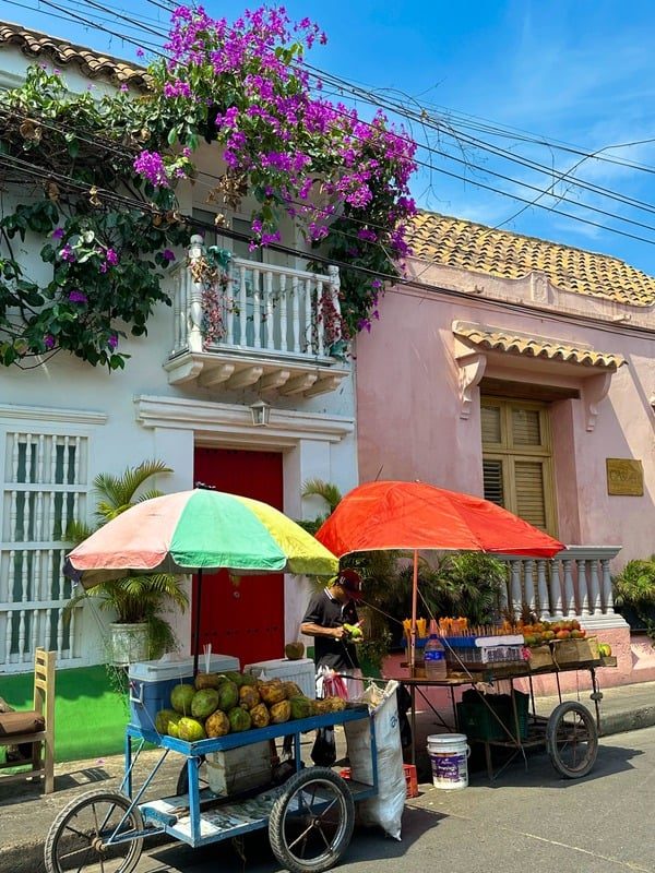 Fruit carts on a colourful street