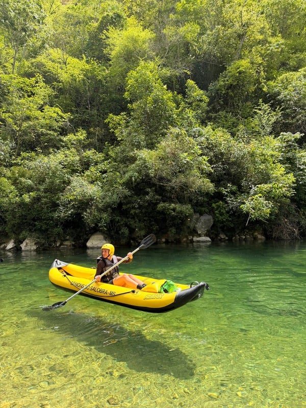 Kayak on clear green water